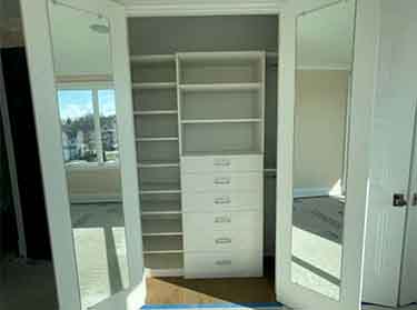Custom closet mirror professionally installed in a modern New York City apartment interior